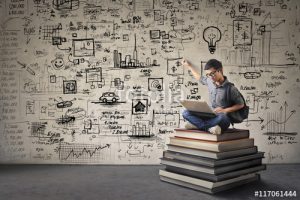 Young businessman writing schemes